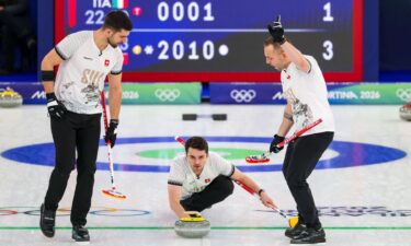 Switzerland curlers come down the ice