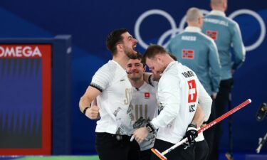 Switzerland players hug to celebrate win