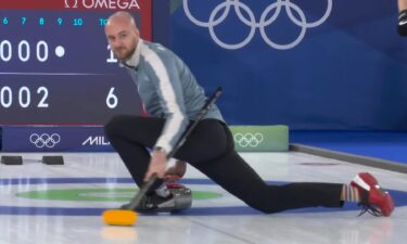 Norway's Magnus Ramsfjell watches his stone down the ice