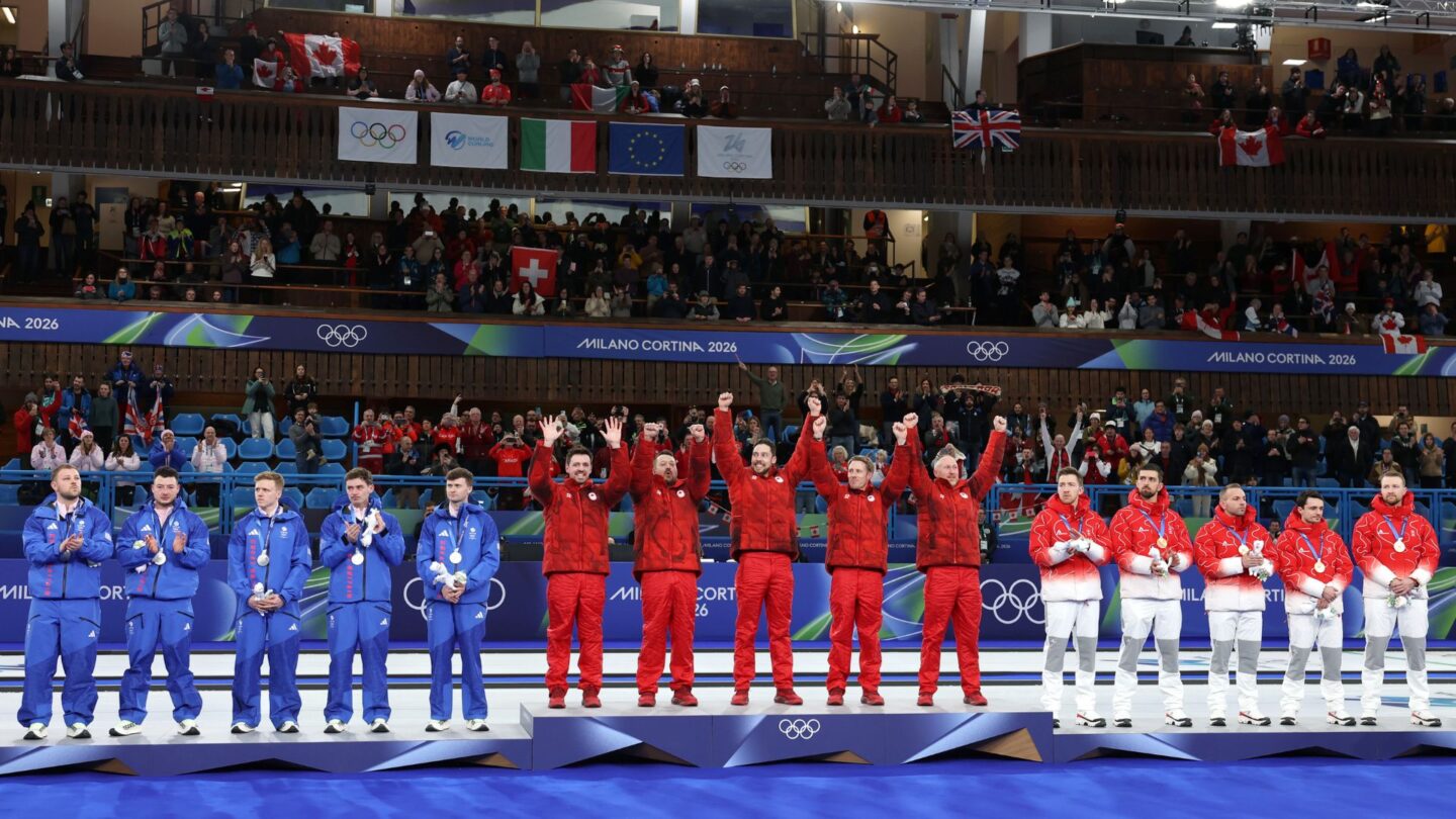 <i>NBC Olympics</i><br/>Curlers stand on the podium with their medals