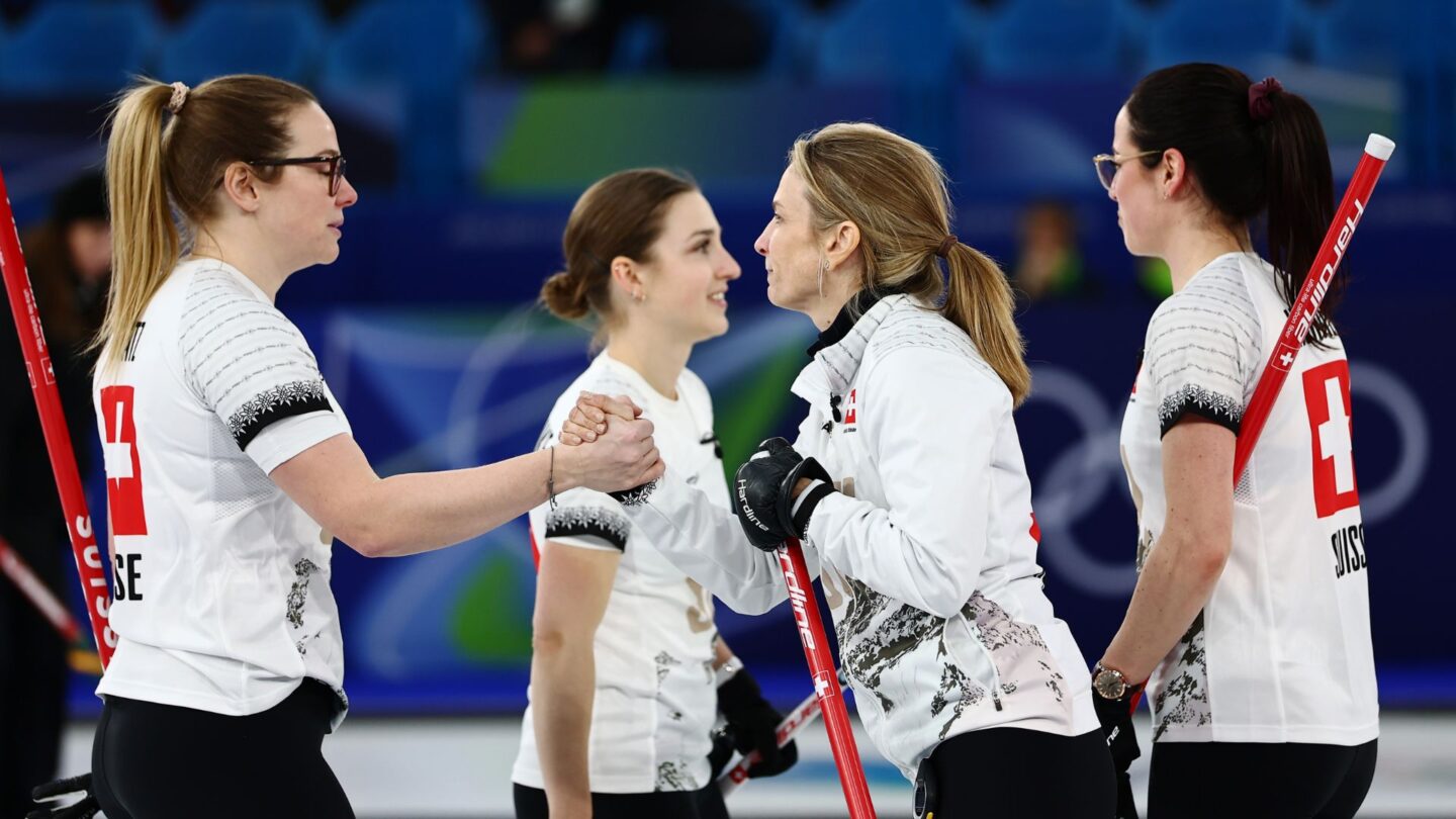 Switzerland's curlers celebrate win