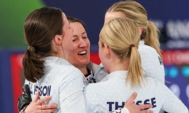 U.S. curling team hugs and celebrates win