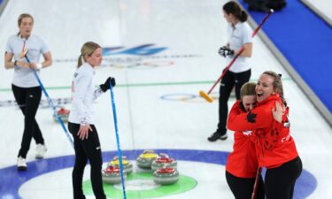 Curlers look over rocks