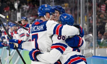 Team USA men's hocky celebrating a goal.