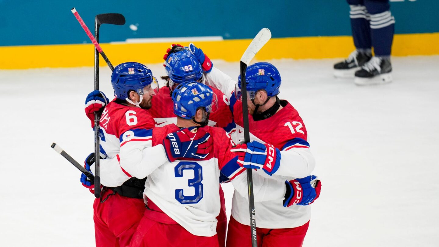 The Czechia men's hockey team celebrates during a win over France at the 2026 Winter Olympics.