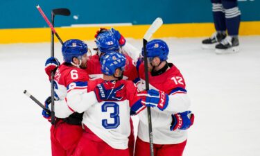 The Czechia men's hockey team celebrates during a win over France at the 2026 Winter Olympics.