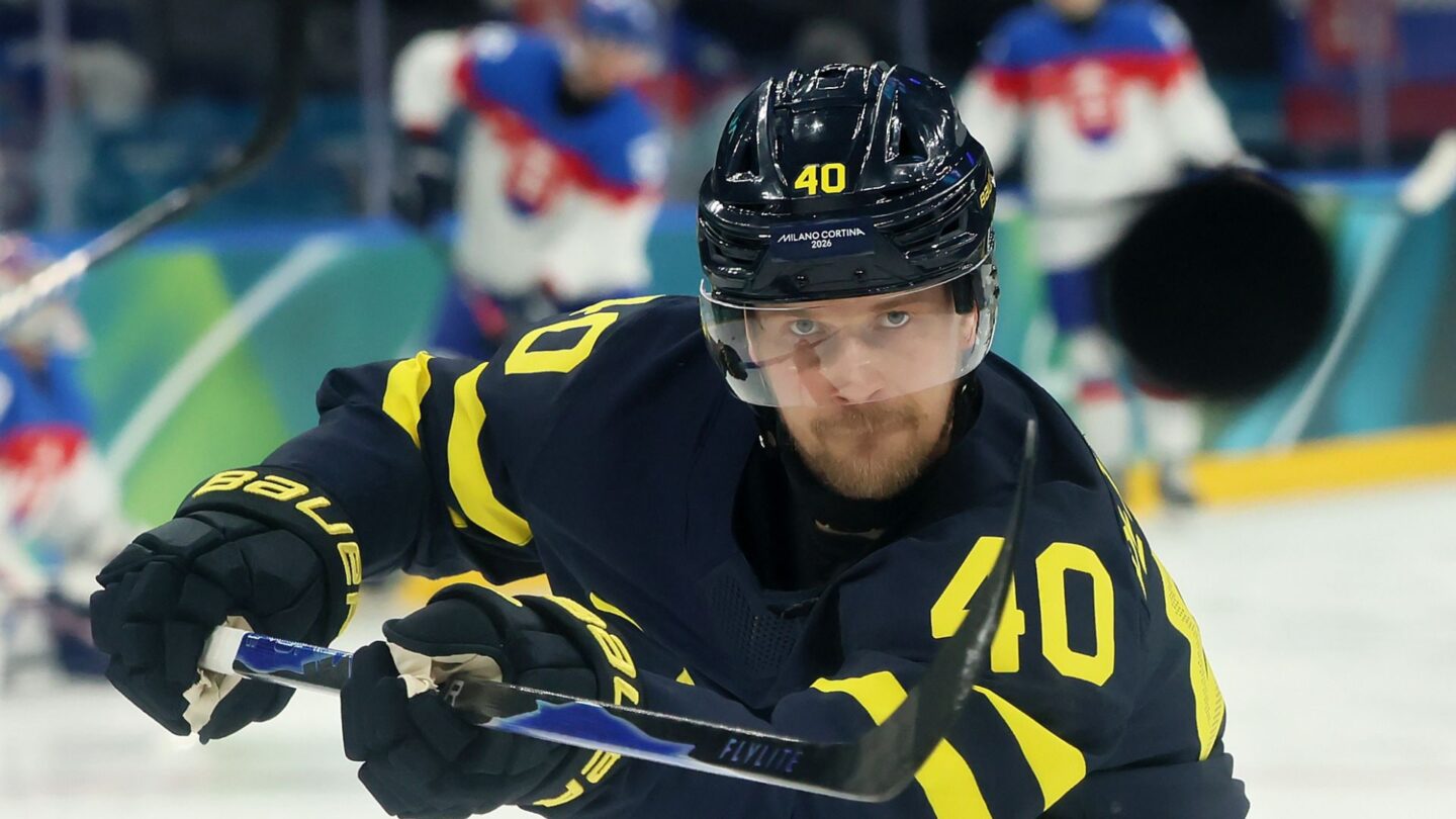 Swedish men's hockey player Elias Pettersson shots during a Group B Olympic matchup with Slovakia.