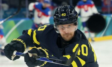 Swedish men's hockey player Elias Pettersson shots during a Group B Olympic matchup with Slovakia.