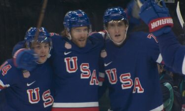 U.S. men's hockey player Noah Hanifin celebrates after scoring against Denmark at the Olympics.