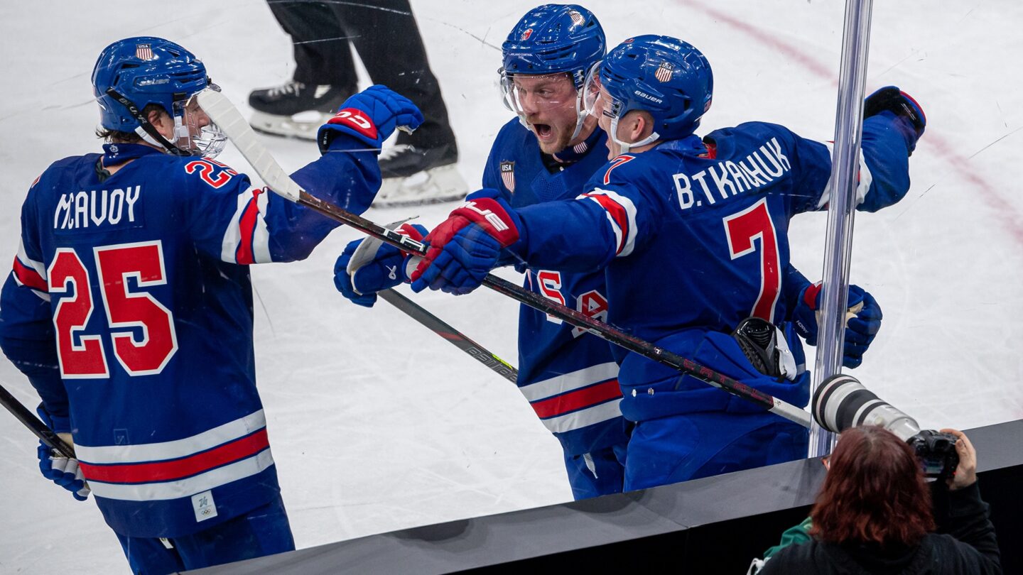 Brady Tkachuk and Charlie McAvoy celebrate a goal.