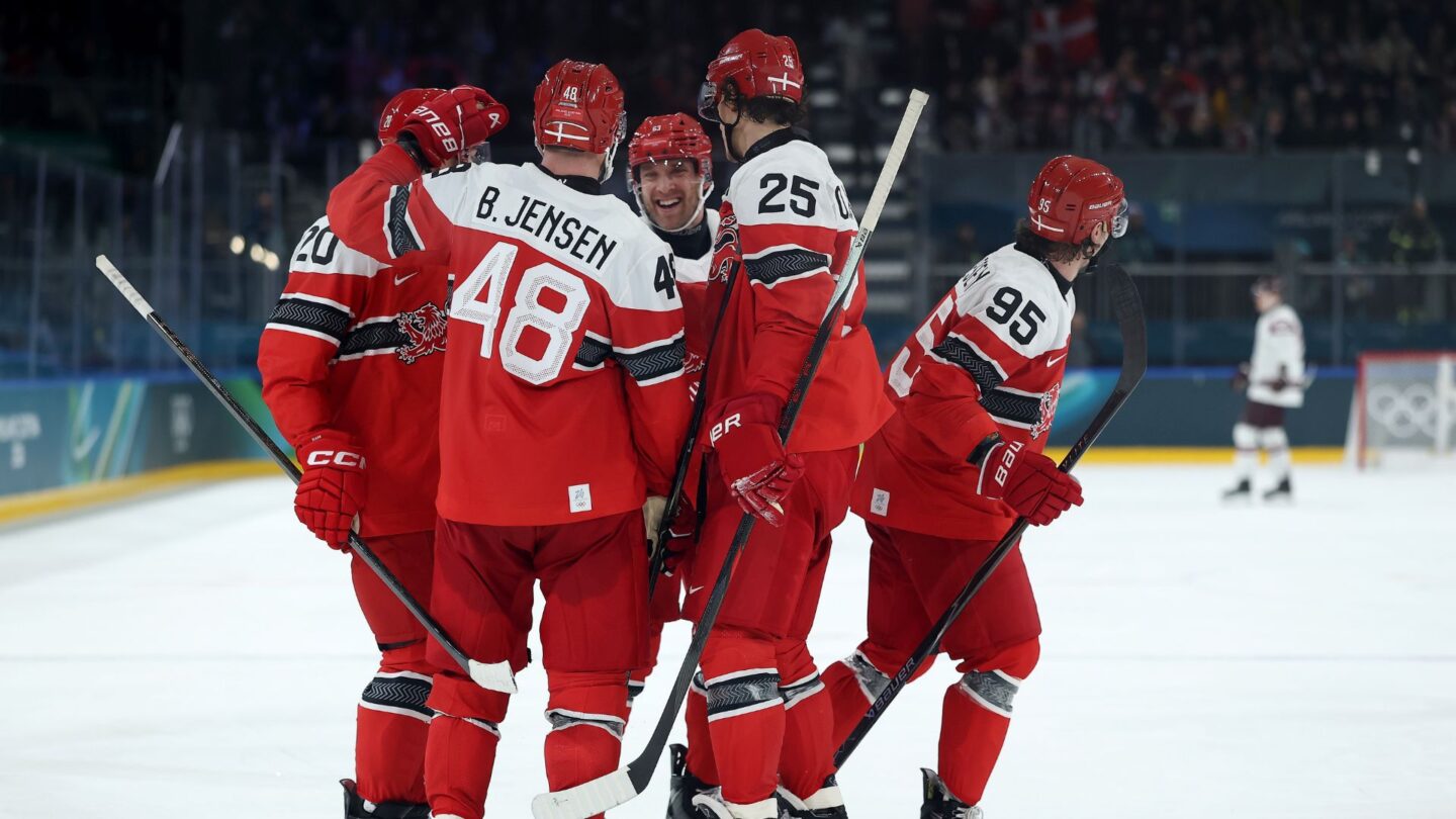 Denmark men's hockey celebrates after defeating Latvia in the final group stage game for both teams at the 2026 Olympics.