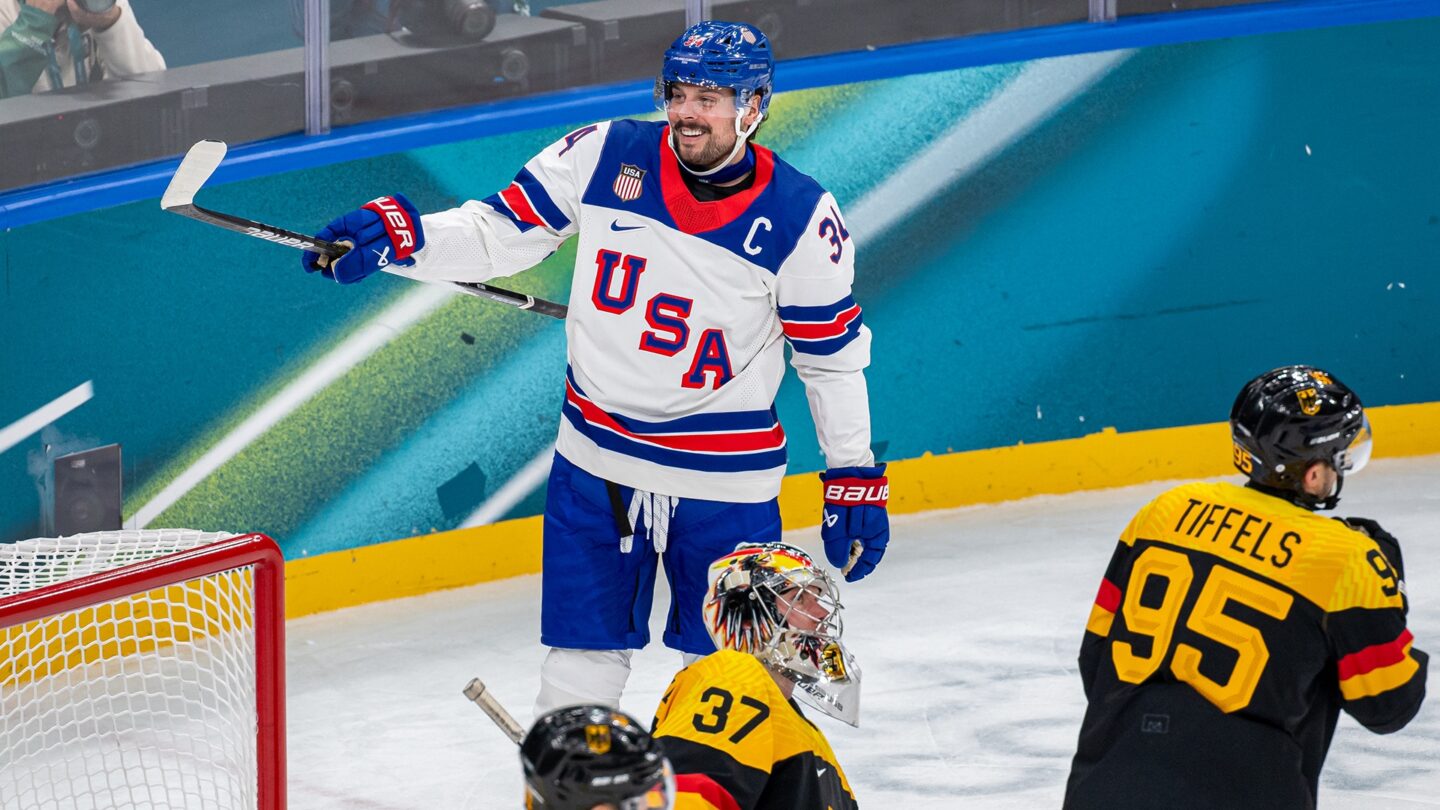 Auston Matthews smiles in celebration.