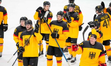 The German men's hockey team celebrates after defeating Italy in the qualification playoff of the 2026 Olympics.