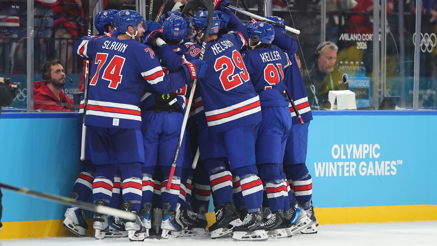 <i>NBC Olympics</i><br/>The U.S. men's hockey team and Quinn Hughes celebrate after defeating Sweden in overtime of the Olympic quarterfinals.