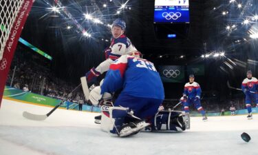 Goalie camera view of U.S. men's hockey player Brady Tkachuk scoring over Slovakia in the men's semifinal matchup at the 2026 Milan Cortina Olympics.