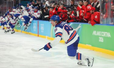 Jack Hughes celebrates scoring in overtime during Team USA's gold medal game against Canada