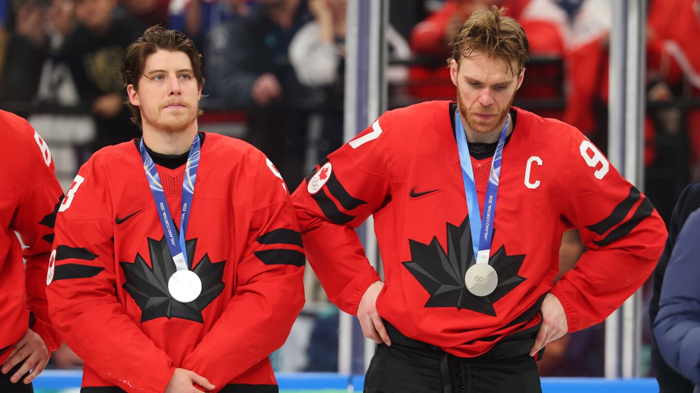 <i>NBC Olympics</i><br/>Canadian players look on with silver medals around their necks.