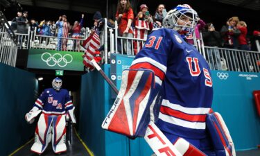U.S. women's hockey goalies Aerin Frankel and Gwyneth Philips enter the arena to take the ice at the 2026 Winter Olympics.