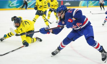 U.S. women's hockey player Taylor Heise shoots and scores against Sweden in the Olympic semifinals.