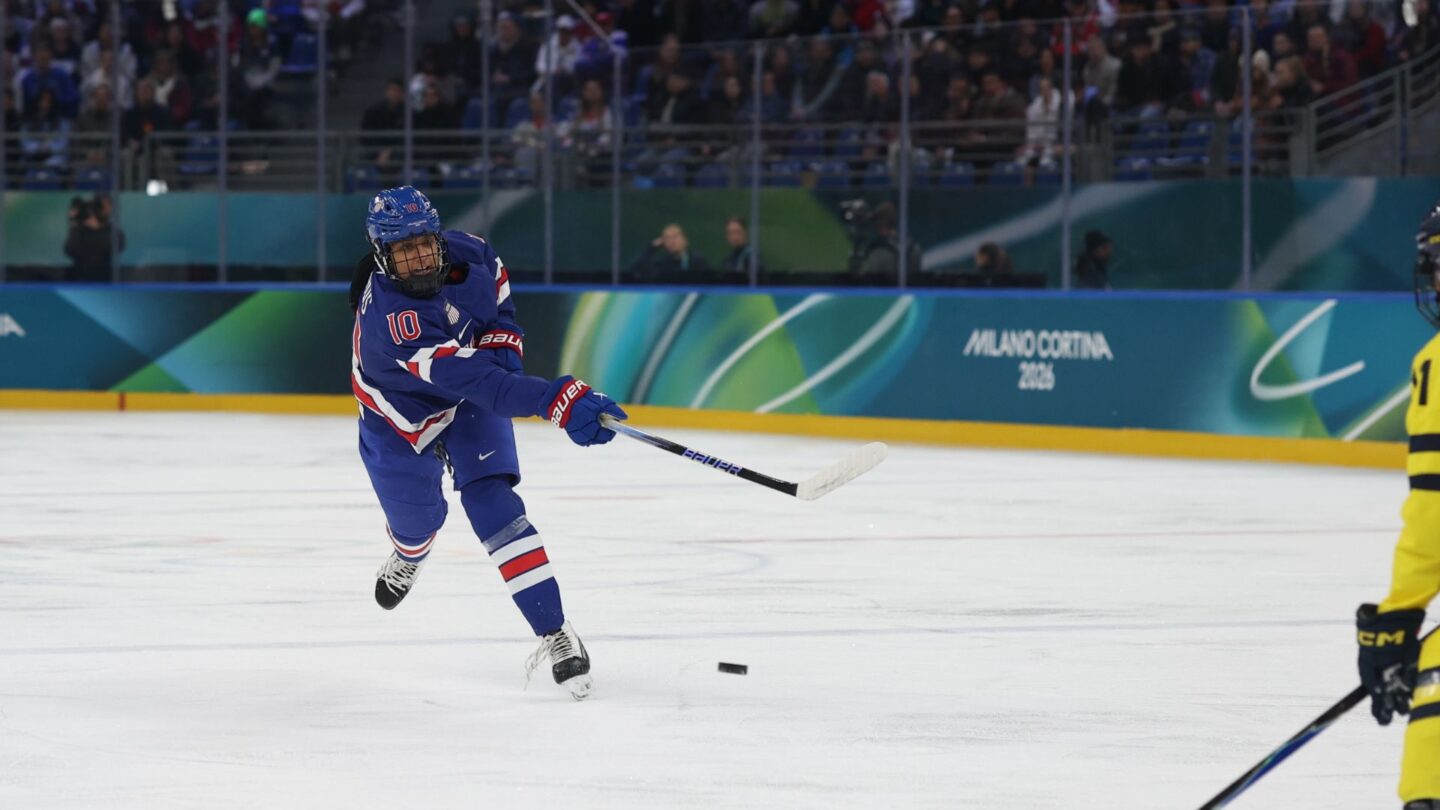 U.S. women's hockey player Laila Edwards shoots during the semifinal game against Sweden.