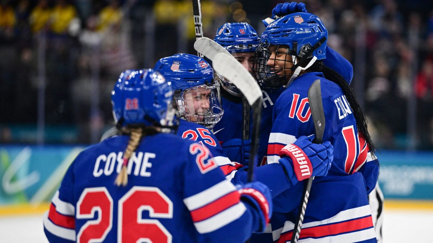 The U.S. women's hockey team celebrates during the semifinal win over Sweden.