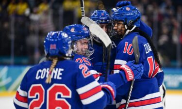 The U.S. women's hockey team celebrates during the semifinal win over Sweden.