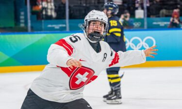 Switzerland's women's hockey player Alina Muller celebrates after scoring the game-winning goal to secure bronze in the Olympic matchup with Sweden.