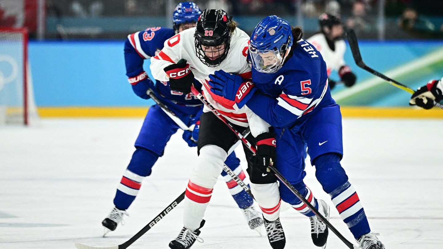 <i>NBC Olympics</i><br/>U.S. women's hockey player Megan Keller fights for the puck on the ice against Canada in the gold medal game at the 2026 Olympics.