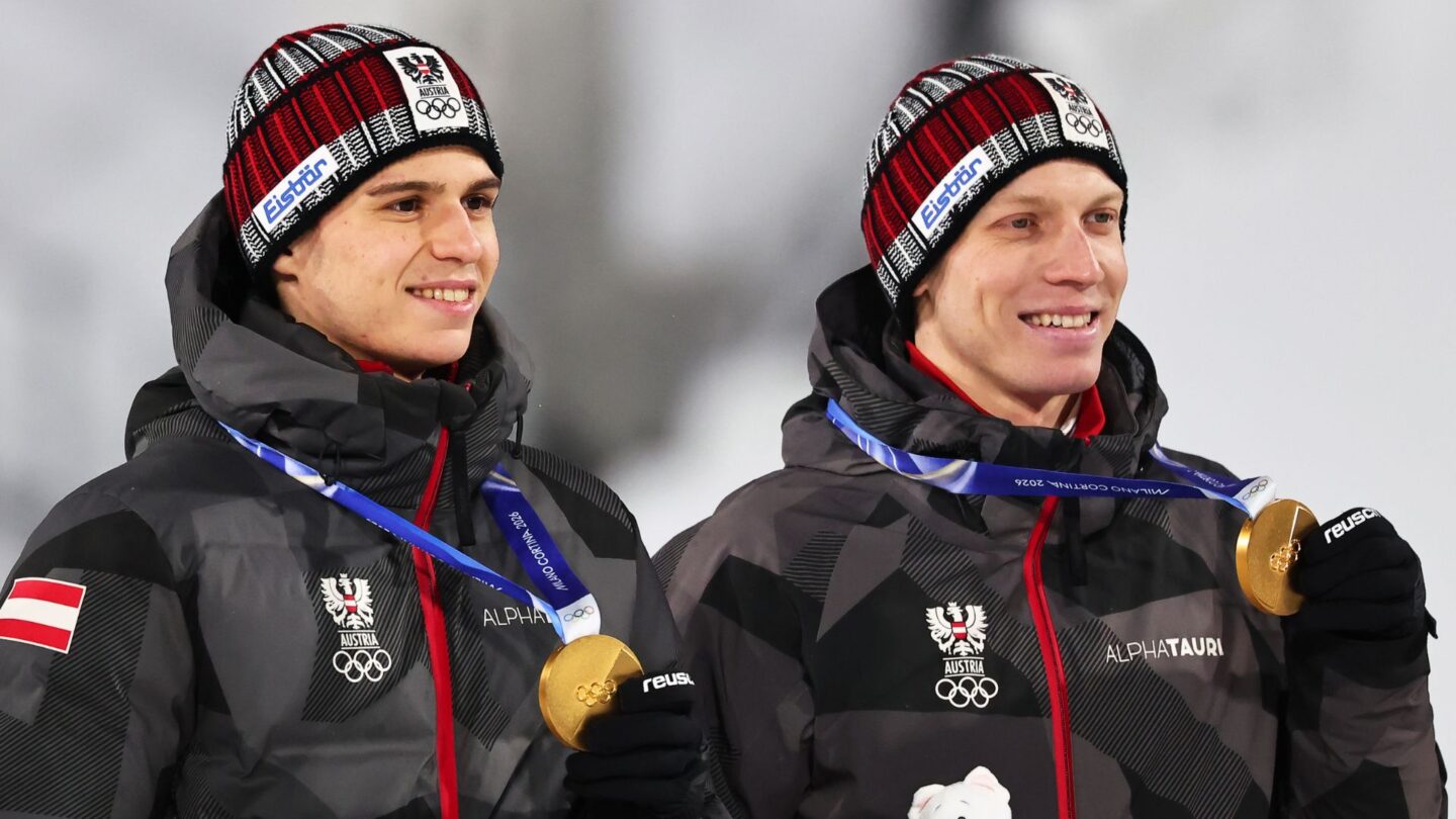 Stephan Embacher and Jan Hoerl pose with their medals