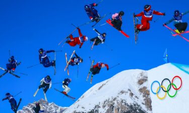 Skiers and snowboarders sail through the air.