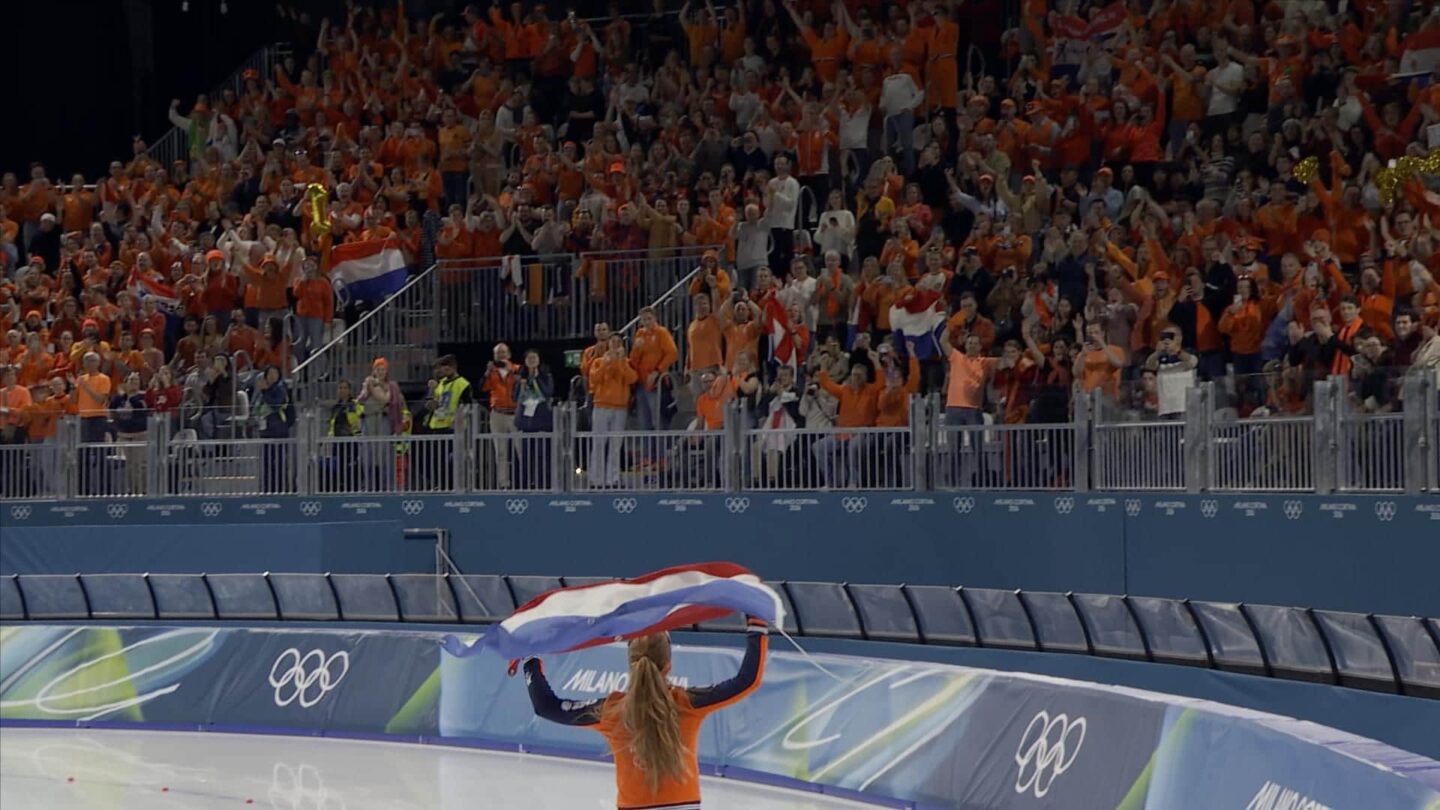 <i>NBC Olympics</i><br/>Speed skater holds Dutch flag and celebrates with cheering fans