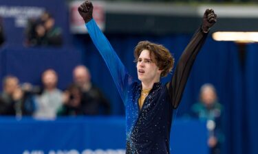 Mikhail Shaidorov celebrates his gold medal.