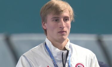 Jordan Stolz taking in the national anthem after winning the 500m
