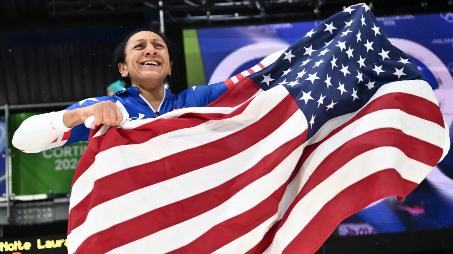 Elana Meyers Taylor holds the American flag.