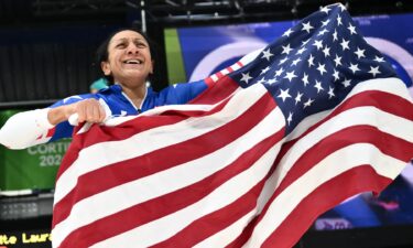 Elana Meyers Taylor holds the American flag.