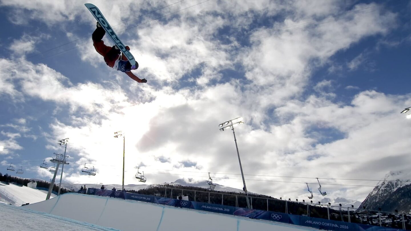 <i>NBC Olympics</i><br/>Snowboarder performs a trick in the halfpipe