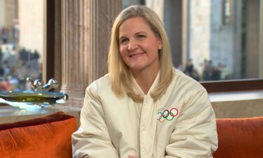 Kirsty Coventry and Mike Tirico