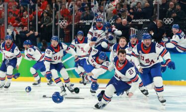 Team USA men's hockey celebrates after winning gold.