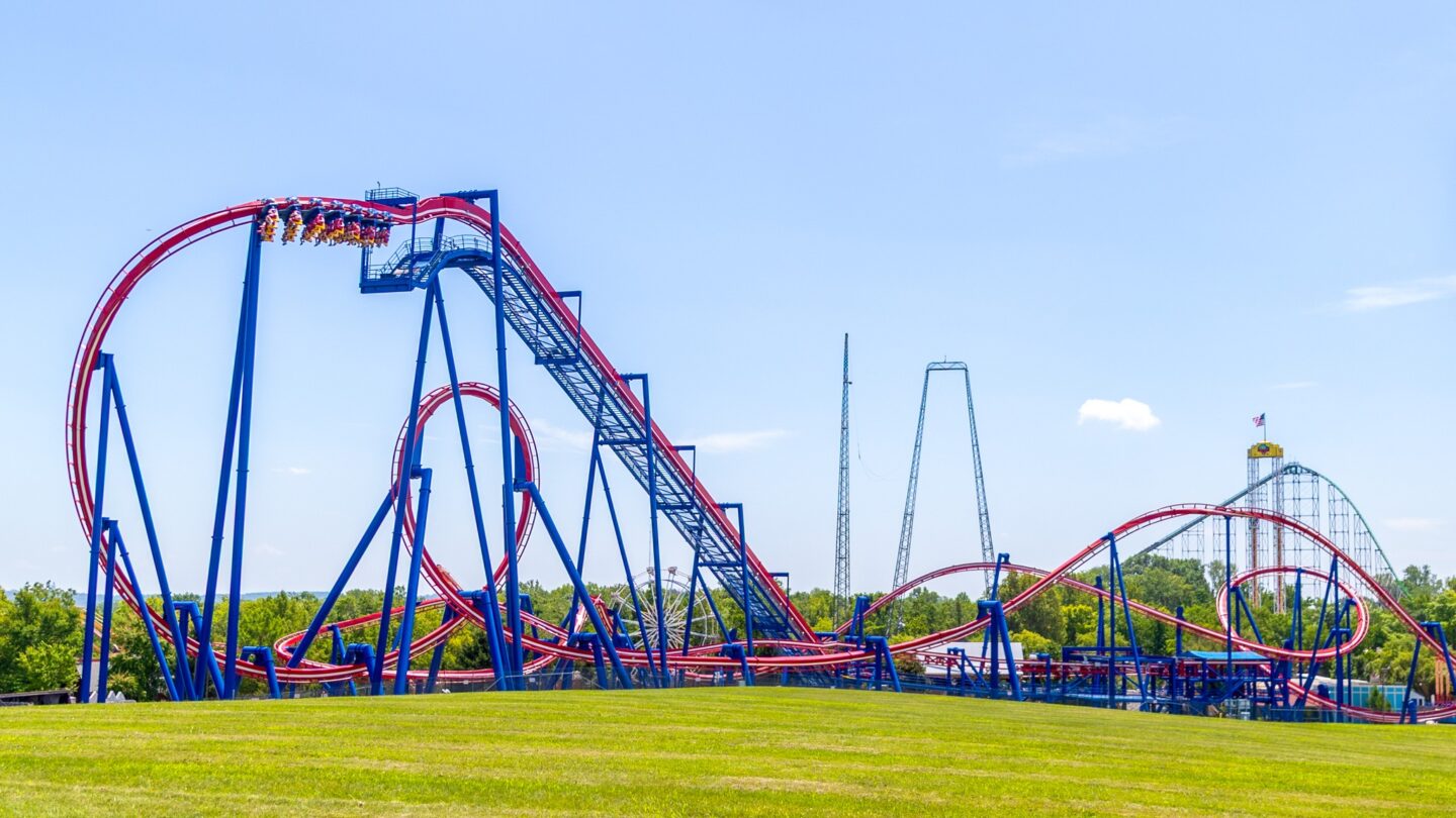 The Patriot is seen at the forefront of Worlds of Fun with people riding the rollercoaster.