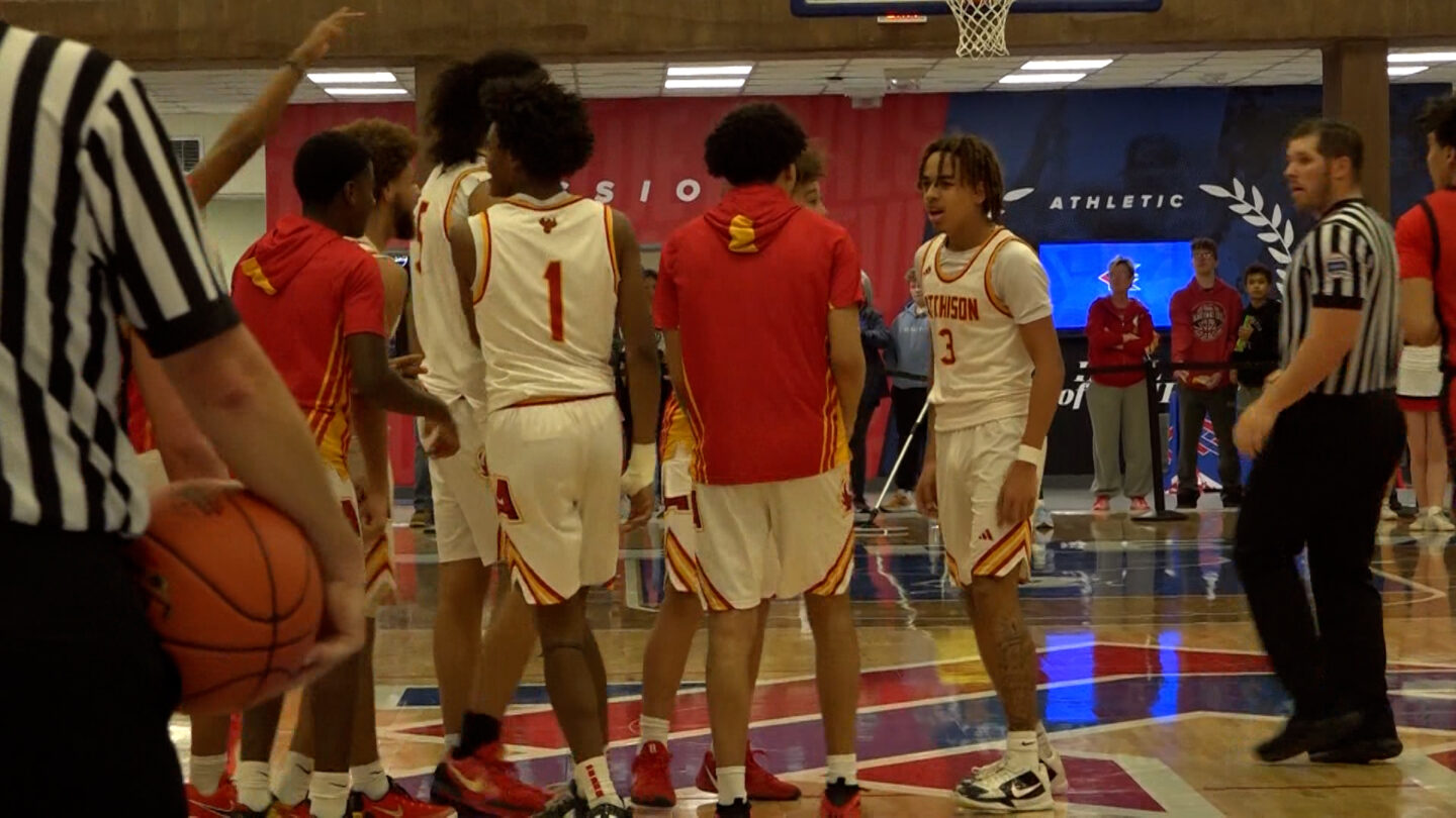 Jeremiah Thompson celebrates with teammates after scoring two of his 29 points in a 73-53 Atchison victory over McPherson.