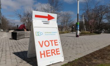 A "Vote Here" sign is seen outside the Durham County Main Library on the last day of early voting in the North Carolina primary election in Durham