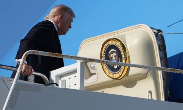 President Donald Trump boards Air Force One at Palm Beach International Airport