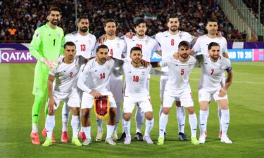 Iran supporters cheer for their team during a match in Tehran in June.