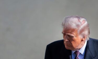 President Donald Trump stops to speak to the media as he departs the White House on February 27