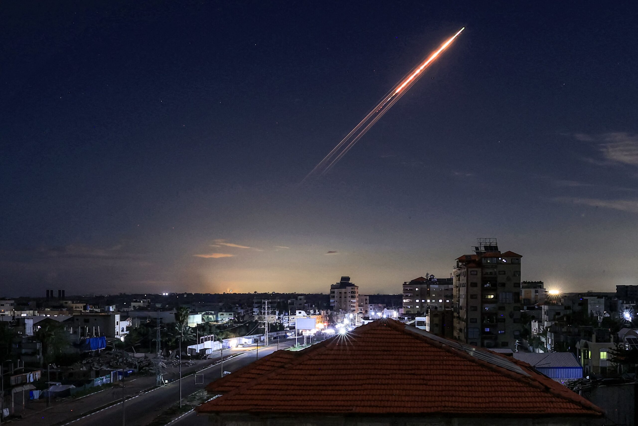 <i>Eyad Baba/AFP/Getty Images via CNN Newsource</i><br/>A missile launched from Iran is pictured in the sky from the Bureij camp for Palestinian refugees in central Gaza on March 1.