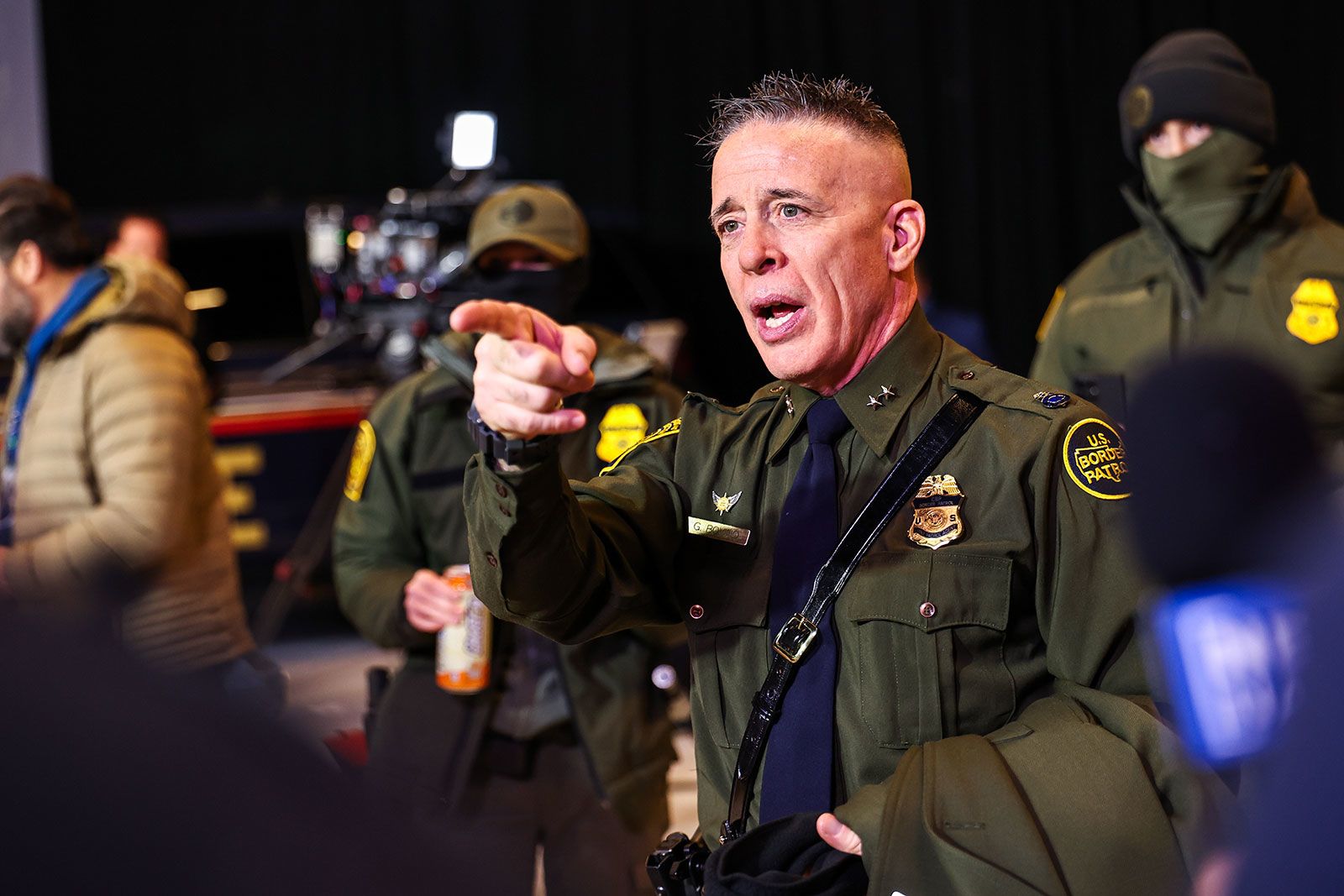 <i>Tim Evans/Reuters via CNN Newsource</i><br/>Federal agents gather next to a damaged vehicle after its driver