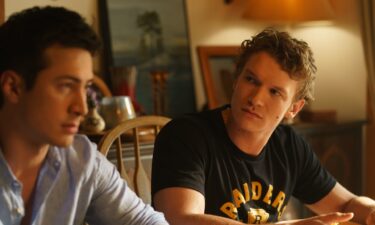 Fans dance onstage during a "Heated Rivalry"-themed club night in West Des Moines