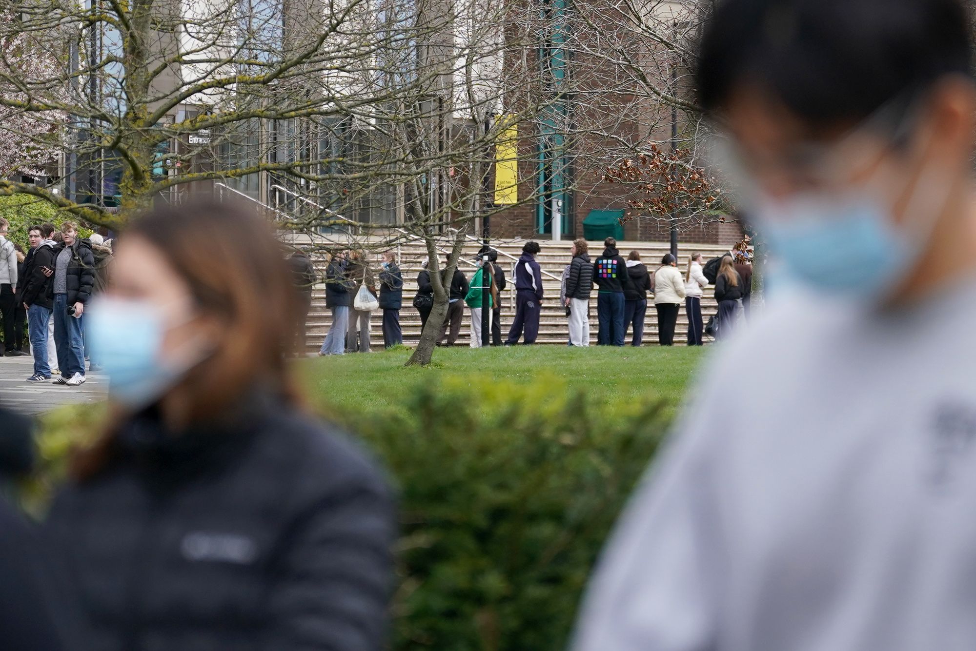<i>Gareth Fuller/PA/AP via CNN Newsource</i><br/>Students line up for antibiotics outside a building at the University of Kent in Canterbury