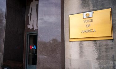 Signage for US broadcaster Voice of America is seen in Washington