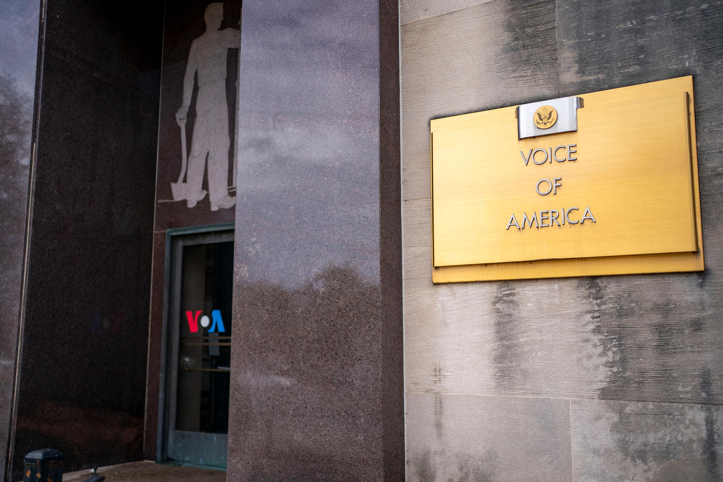 <i>Bonnie Cash/AFP/Getty Images via CNN Newsource</i><br/>Signage for US broadcaster Voice of America is seen in Washington